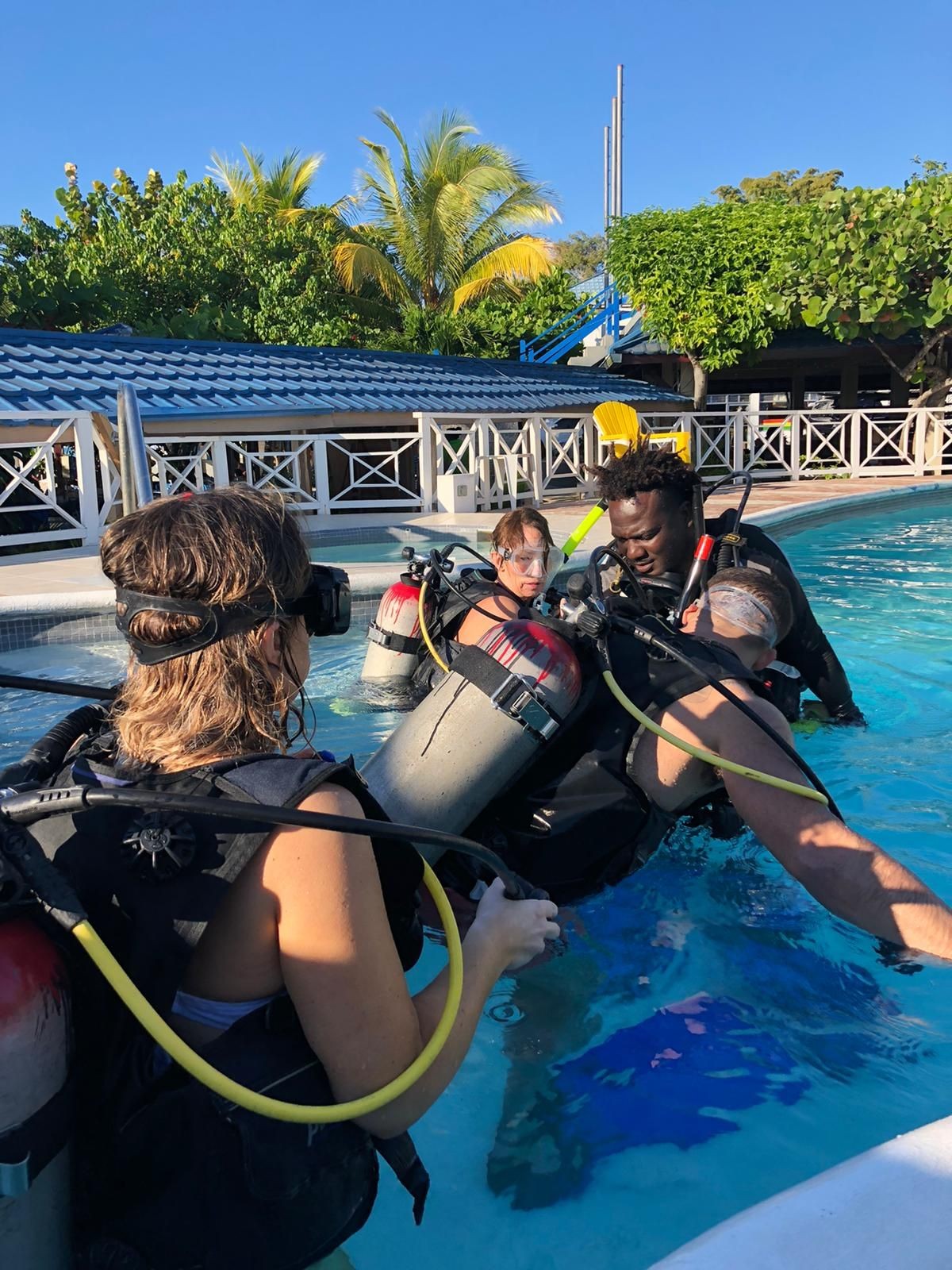 Discover Scuba Diving Students getting there pool training before they go out to the Reef for their DSD underwater dive.